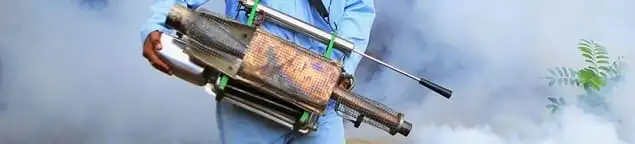 Fumigation technician using a fogger for deep pest treatment in West Palm Beach, FL